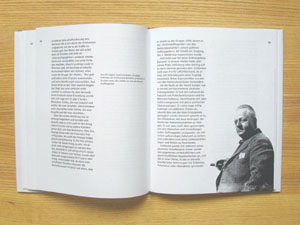 a white book with narrow columns of text and the photo of a fat man